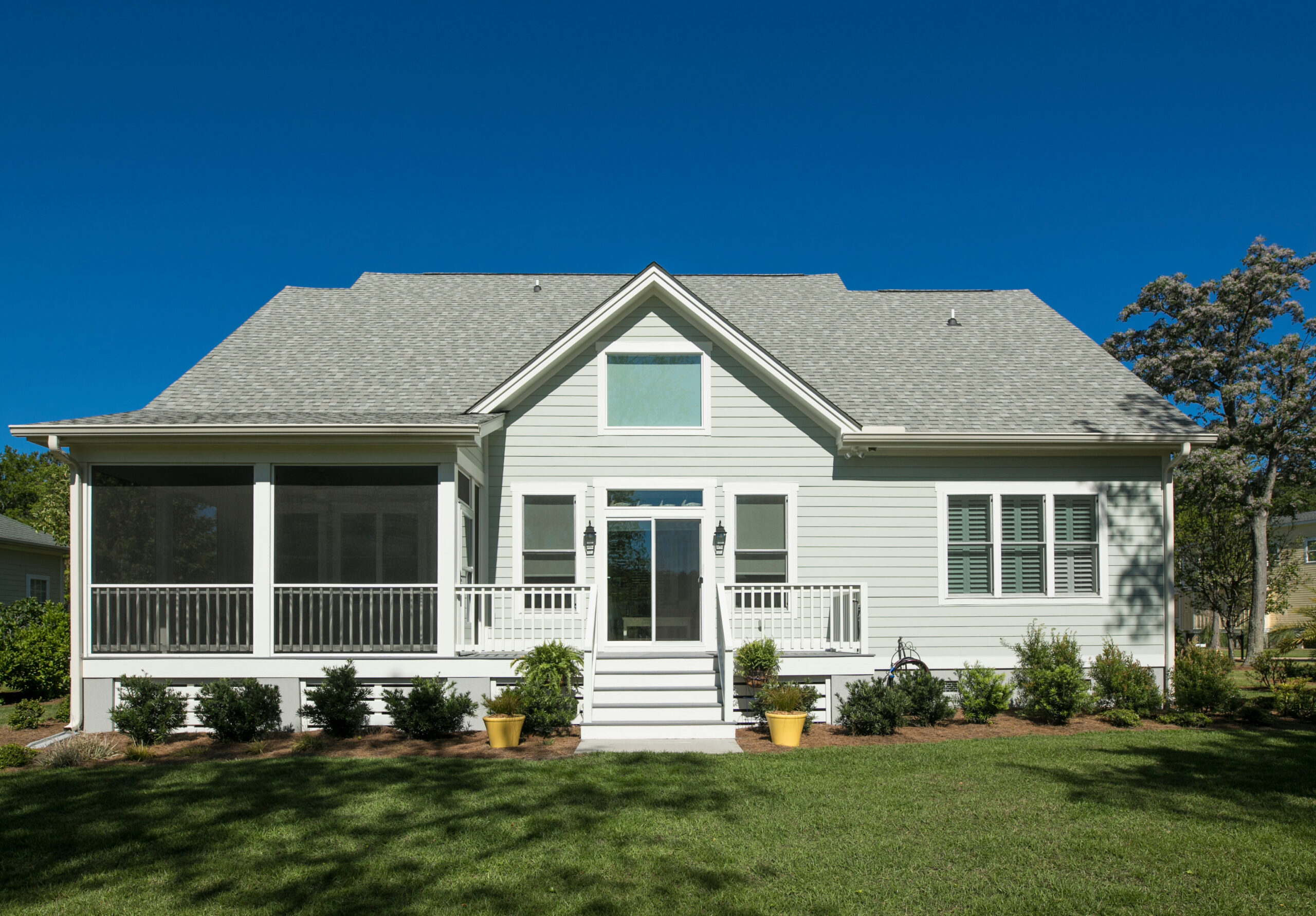 Rear elevation of beautiful home with landscaped garden.